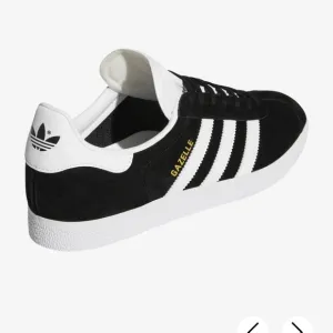 Adidas Black and White Sneakers with Signature Stripes