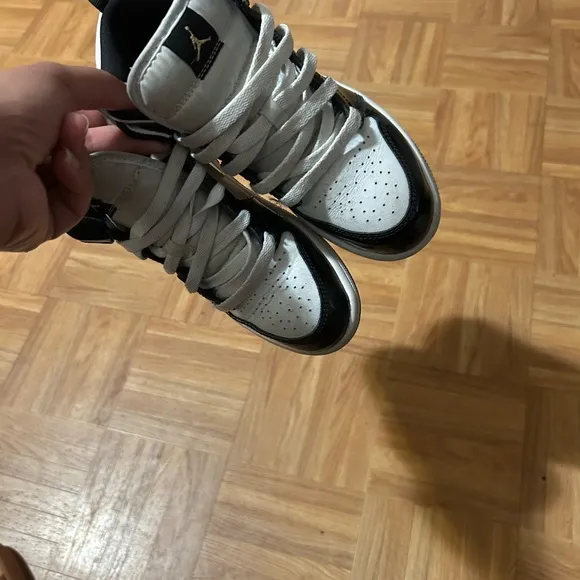 Nike Black and Gold Sneakers with Luxurious Design