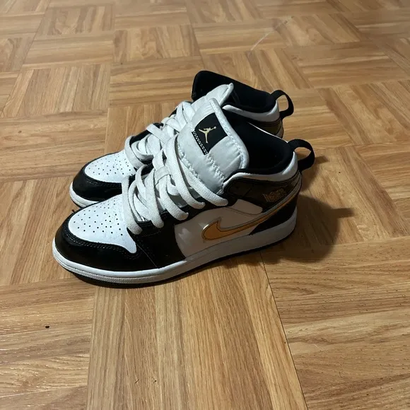Nike Black and Gold Sneakers with Luxurious Design