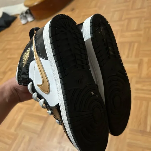 Nike Black and Gold Sneakers with Luxurious Design